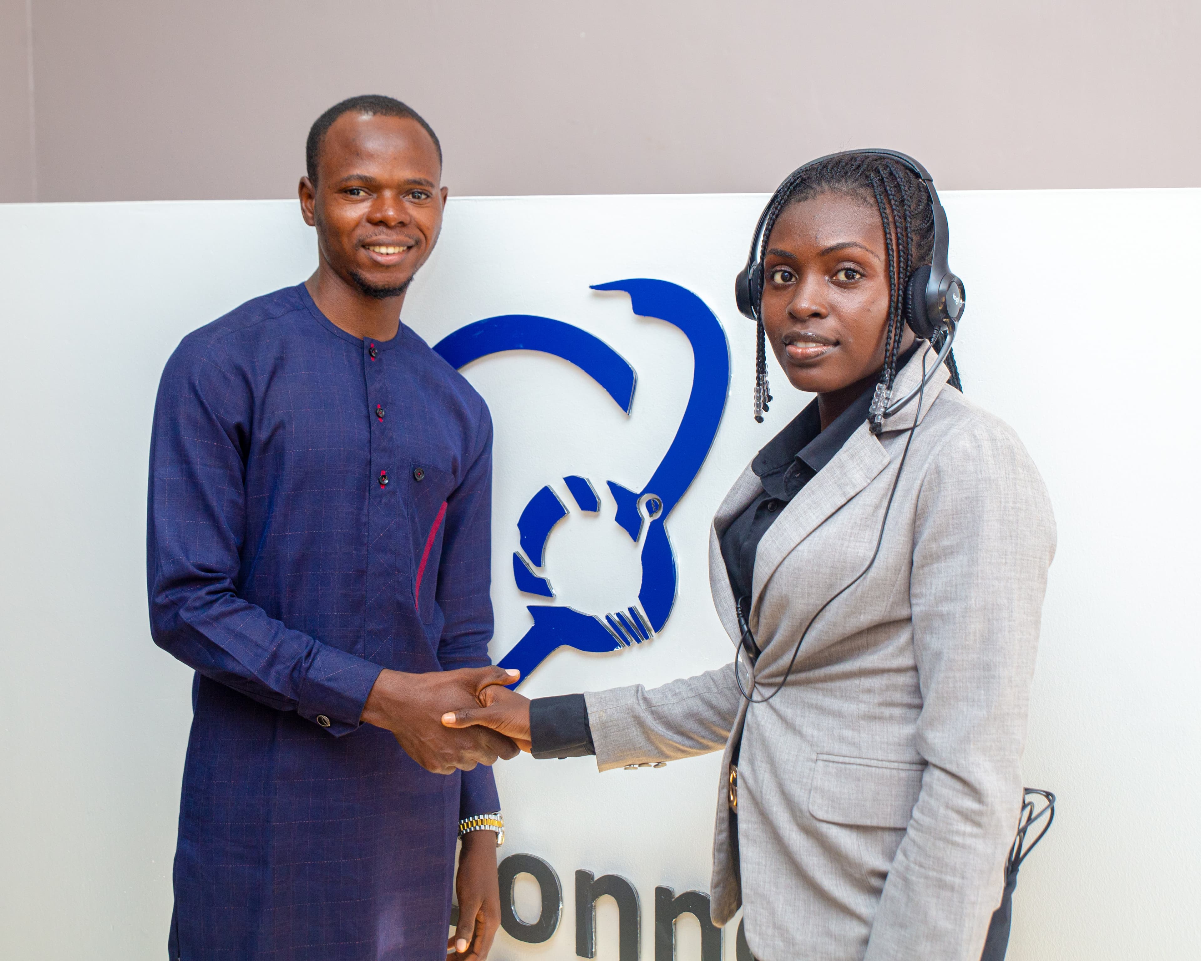 Two TeleConnect staff members shaking hands
