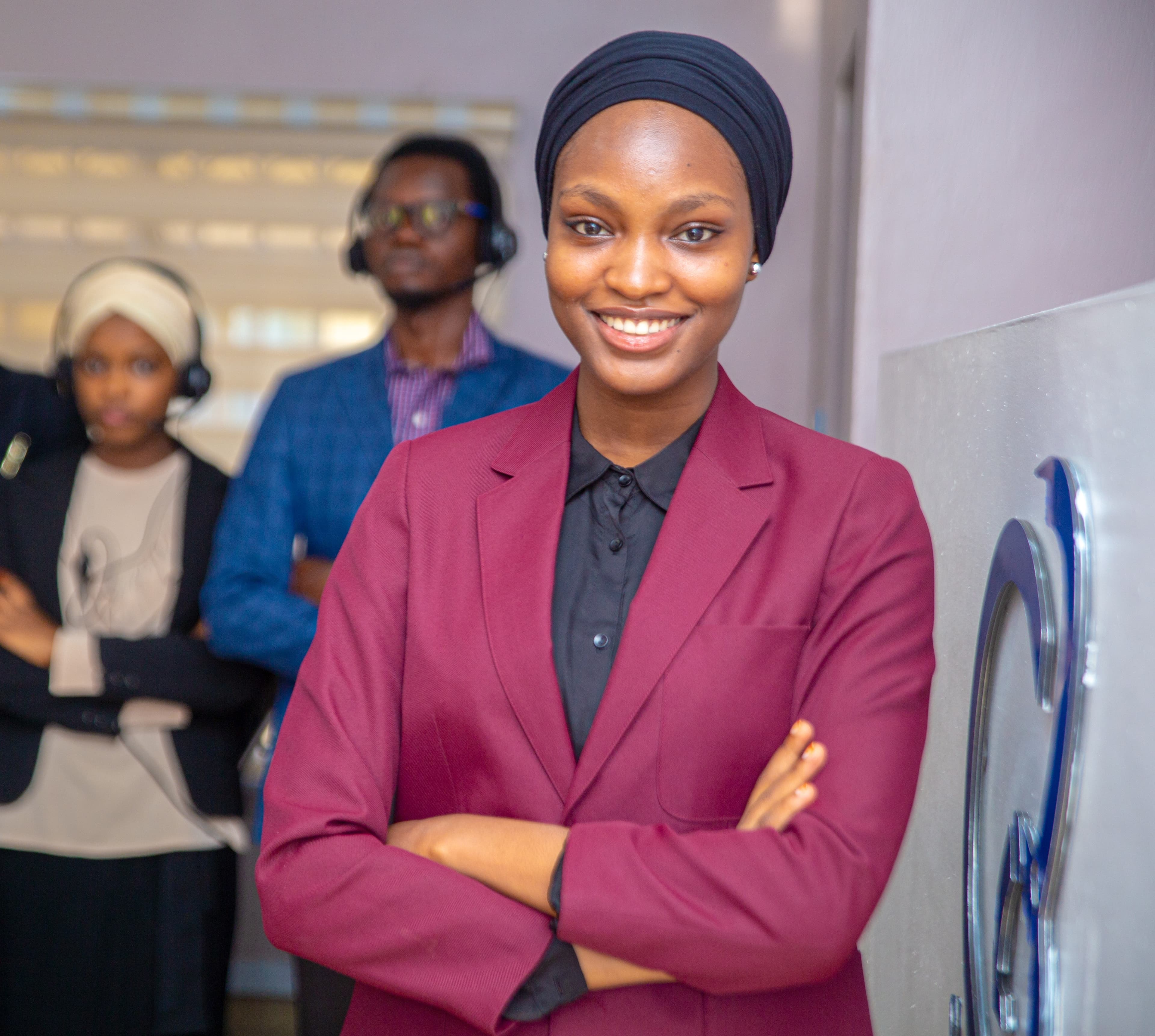 TeleConnect team members standing together in the Abuja office